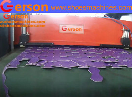 Automatic machine cutting material on conveyer belt